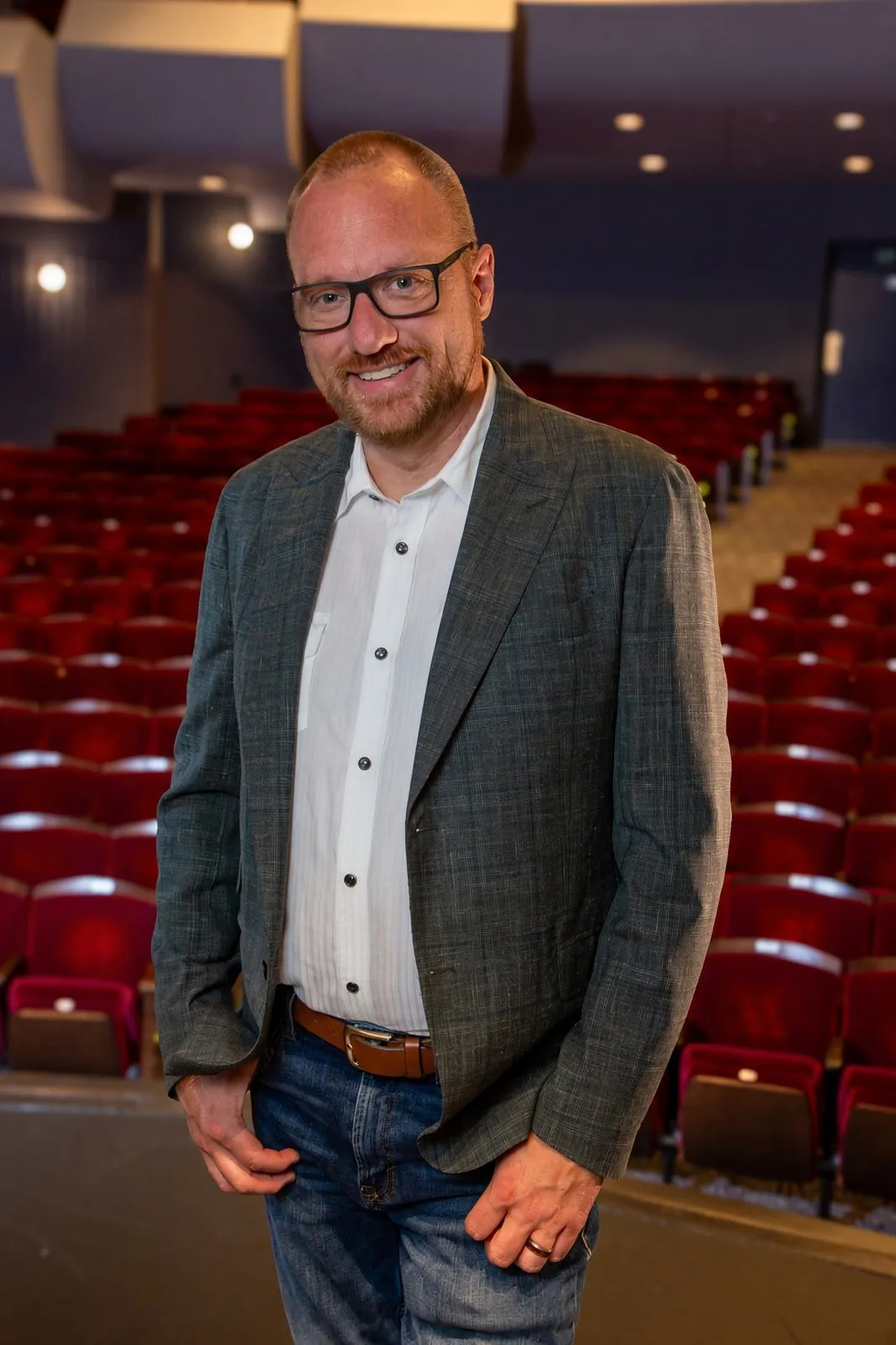 Ryan Steidinger, Principal of Live Axis Consulting, on a theater stage